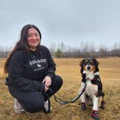 Australian Shepherd service dog Promise with her owner